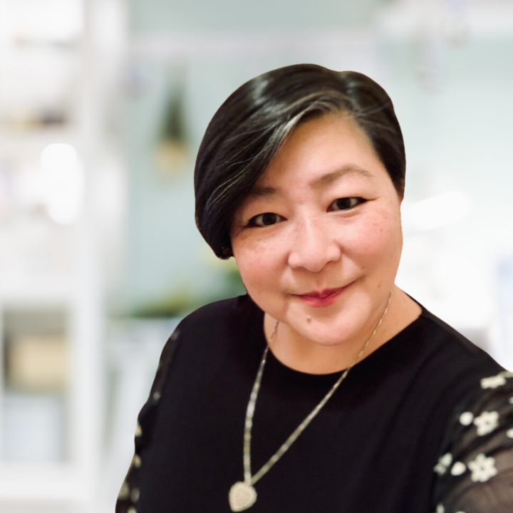 June is a woman with short hair and a friendly smile.